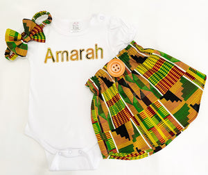 Girls' kente fabric skirt set with a personalized embroidered t-shirt and a matching headband